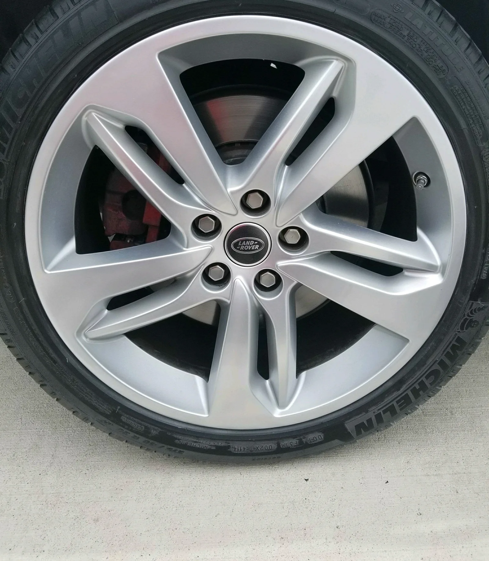 Land Rover — curb rash refinished. — after refinishing