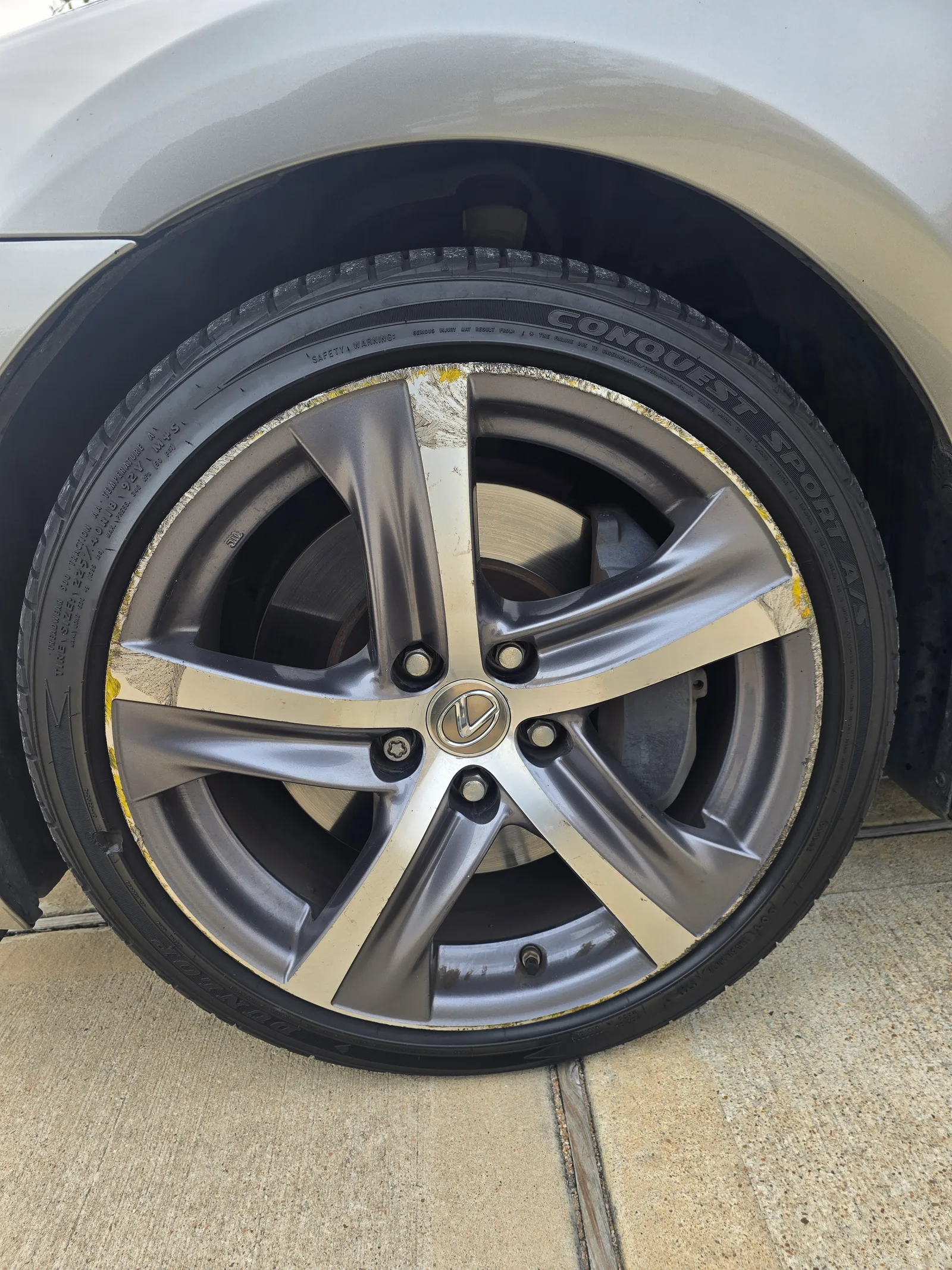 Lexus — curb rash & paint transfer, gone. — before refinishing
